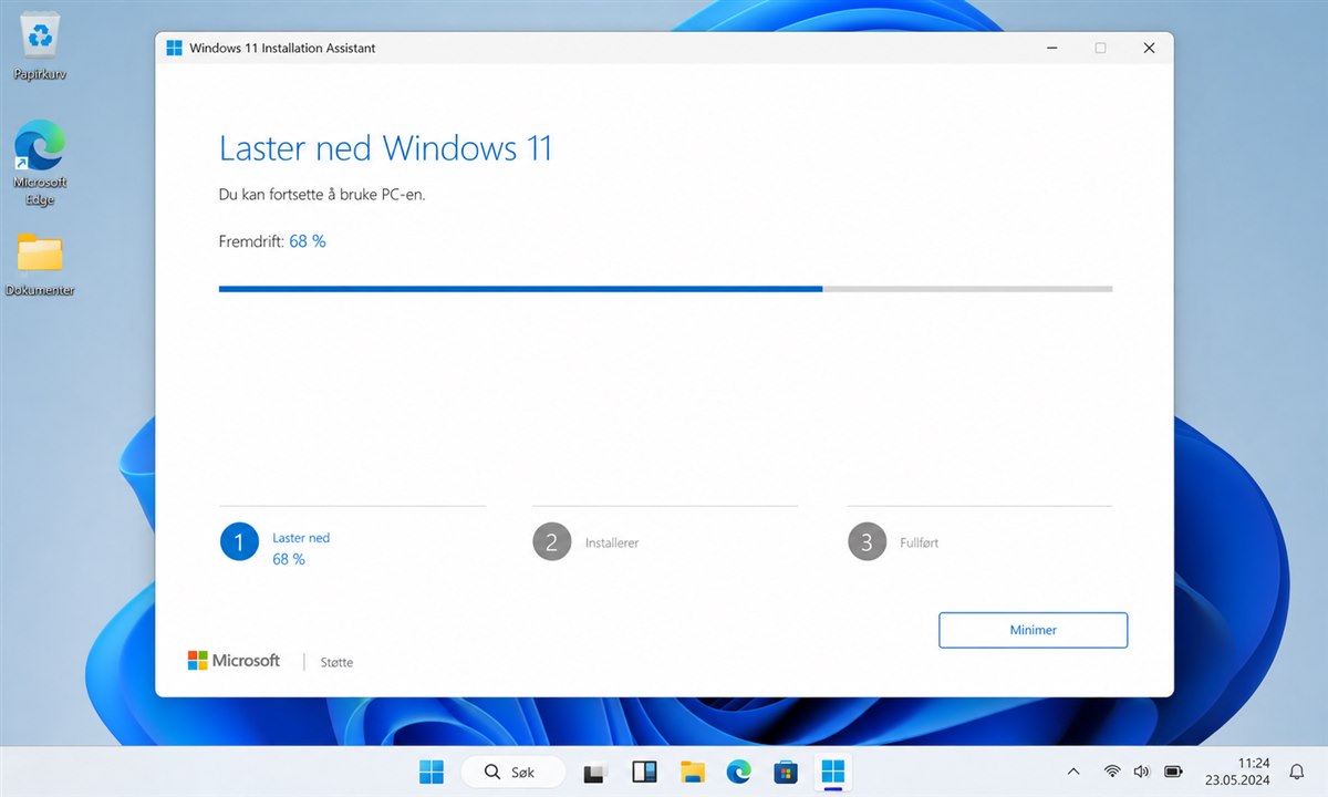 Windows 11 Installation Assistant laster ned og installerer